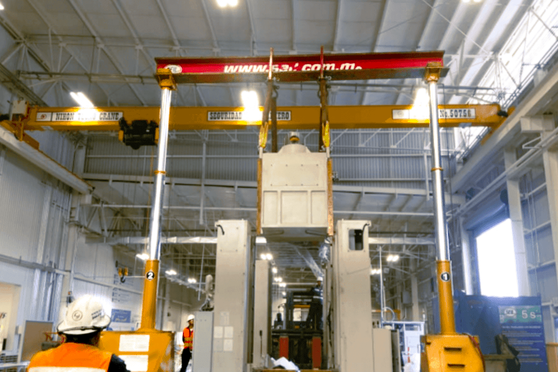 Assembly of 300-ton press slide machinery using a 200-ton Gantry.